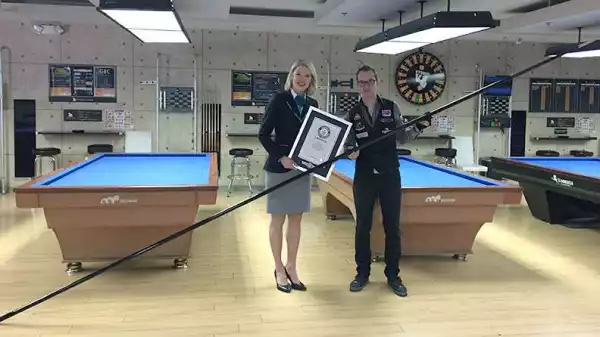 world’s longest pool cue and breaks five trick shot records